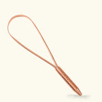 A luxurious Ayurvedic copper tongue scraper from Art of Vedas, designed to gently remove toxins and impurities from the tongue, promoting a healthier mouth and body.